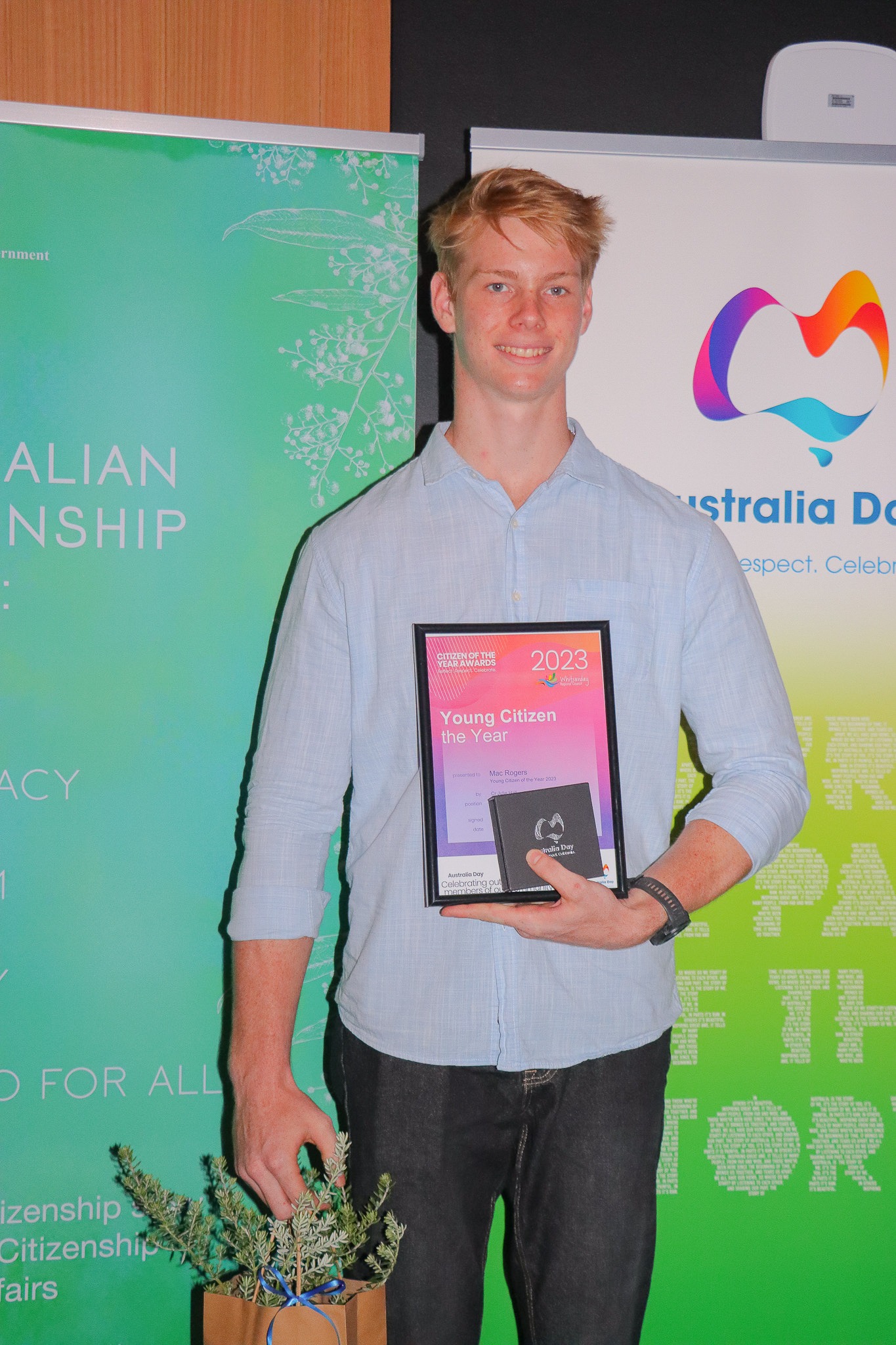 Mac Rogers holding the certificate for Whitsunday Young Citizen of the Year