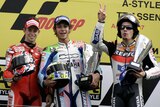 Cool relationship ... Casey Stoner (l) and Valentino Rossi sharing the podium with Nicky Hayden after the Dutch MotoGP