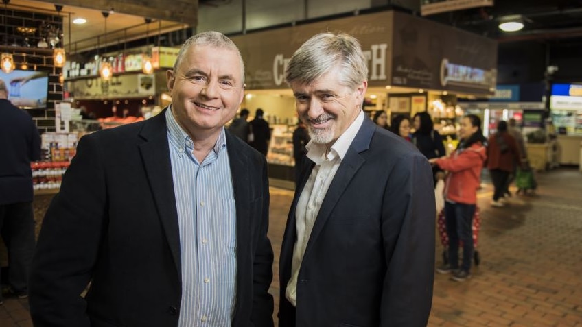 Matthew Abraham and David Bevan stand in the Adelaide Central Markets.
