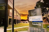 A Federation University sign at sunset