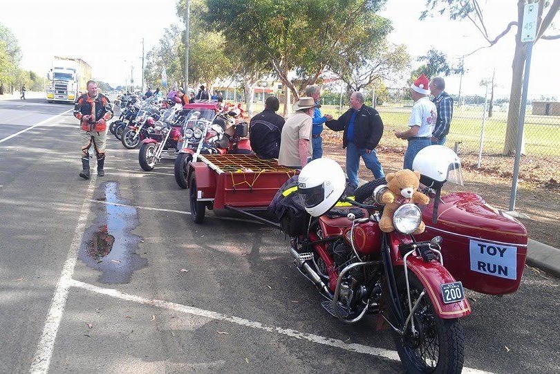 John Finnigan has a red Indian motorcyle he leads the annual Roma toy run on