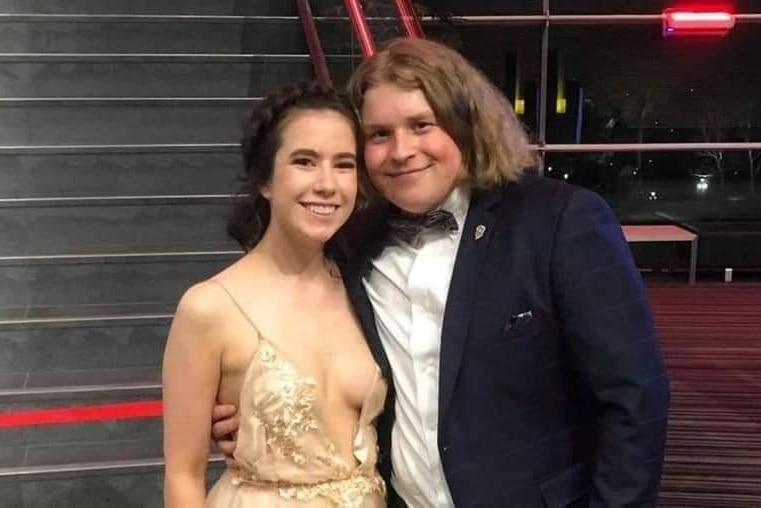 A young couple in formal attire.