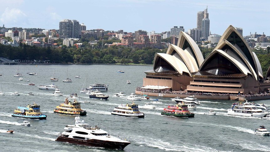 View from the Sydney Harbour Bridge of ferries racing in the Ferrython past the Sydney Opera House.