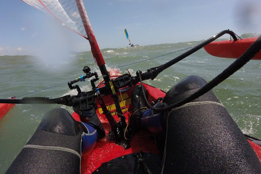 Waves lift the starboard side of George Kirkland's trimaran kayak out of the water as he passes Cape Sandwich