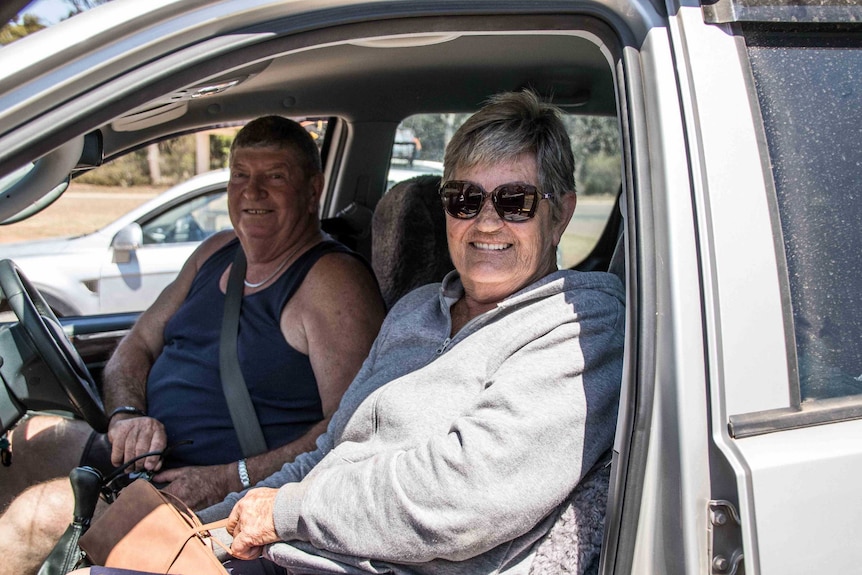 Margaret and Michael in their car. Michael is driving.