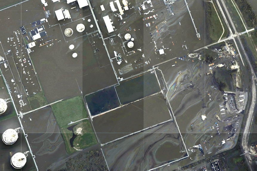 A satellite image shows an oil slick at a flooded refinery in Louisiana