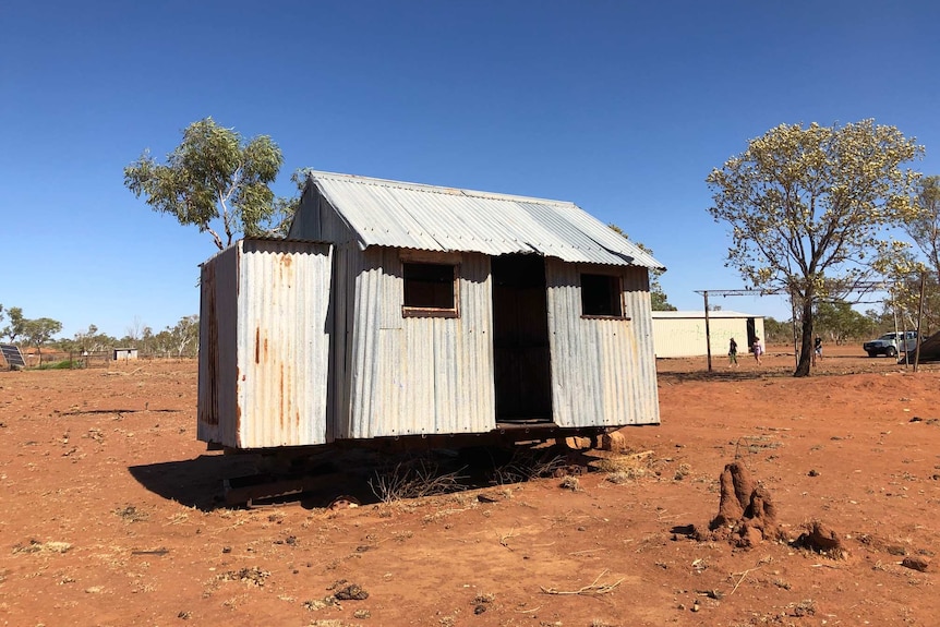 Image of an abandoned shack, made of corrugated iron, sitting in the remote desert in Western Australia.