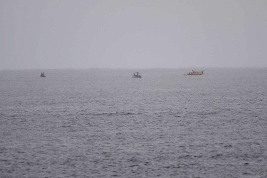 Emergency crews and water police search for the wreckage of a plane that crashed at Barwon Heads in Victoria.