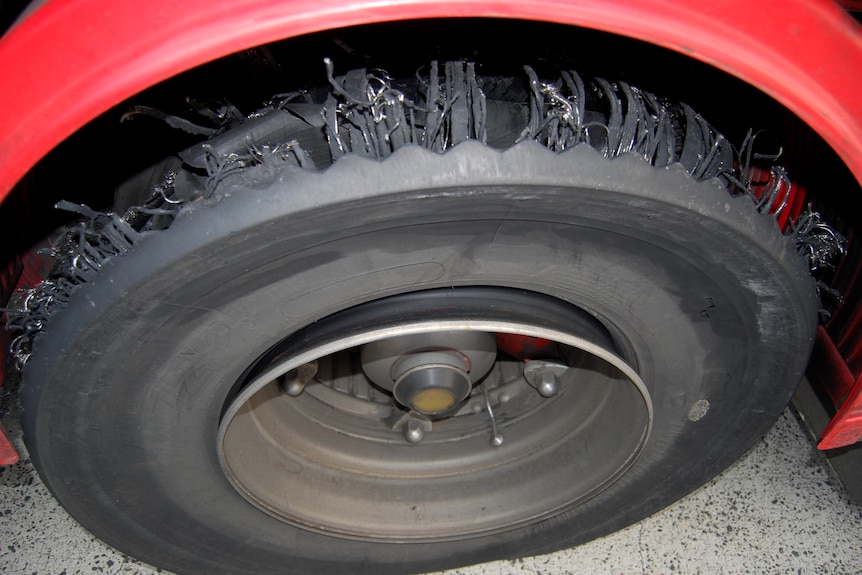 A photo released on February 22, 2012, shows a shredded tyre on a truck at Lennons Transport Services.