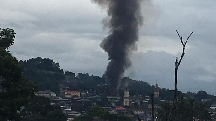 Black smoke is seen rising above Marawi City.