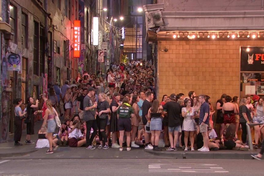 A long line of people waits outside the Forum Theatre.