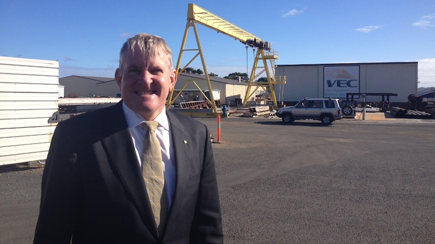 Industry Minister Ian Macfarlane standing at an industrial engineering agency in north-west Tasmania