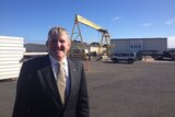 Industry Minister Ian Macfarlane standing at an industrial engineering agency in north-west Tasmania