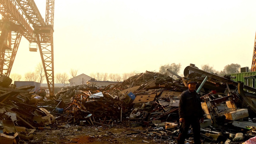 A worker at a scrap metal recycling facility at Tongzhou, Beijing.