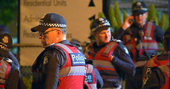 Police officers at night on the street.