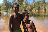 Two Aboriginal children play in McArthur River near Borroloola.