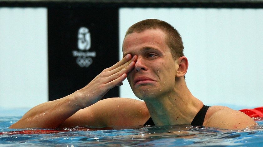 An emotional Cesar Cielo Filho wins Brazil's first swimming gold medal.