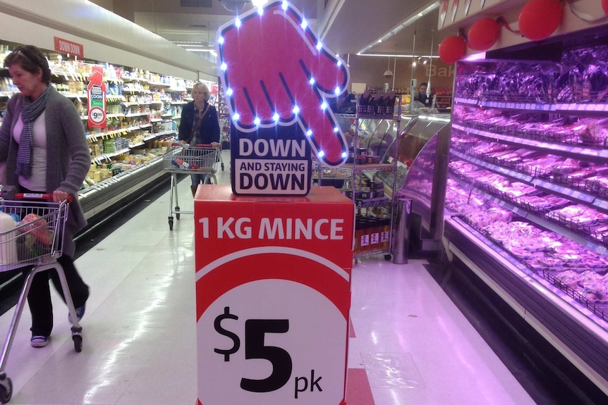 Downward pointing finger as part of the Coles "Down, down" ad campaign.