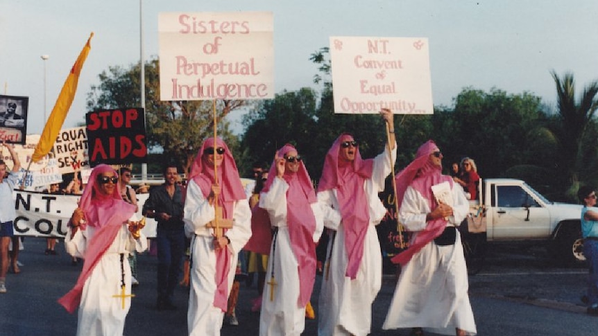 An old photo of people at a rally.