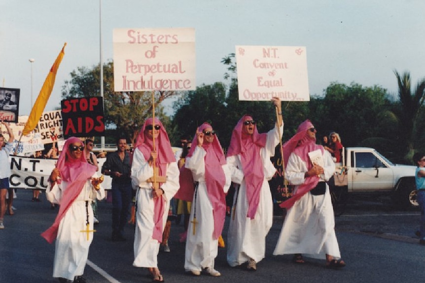 An old photo of people at a rally.