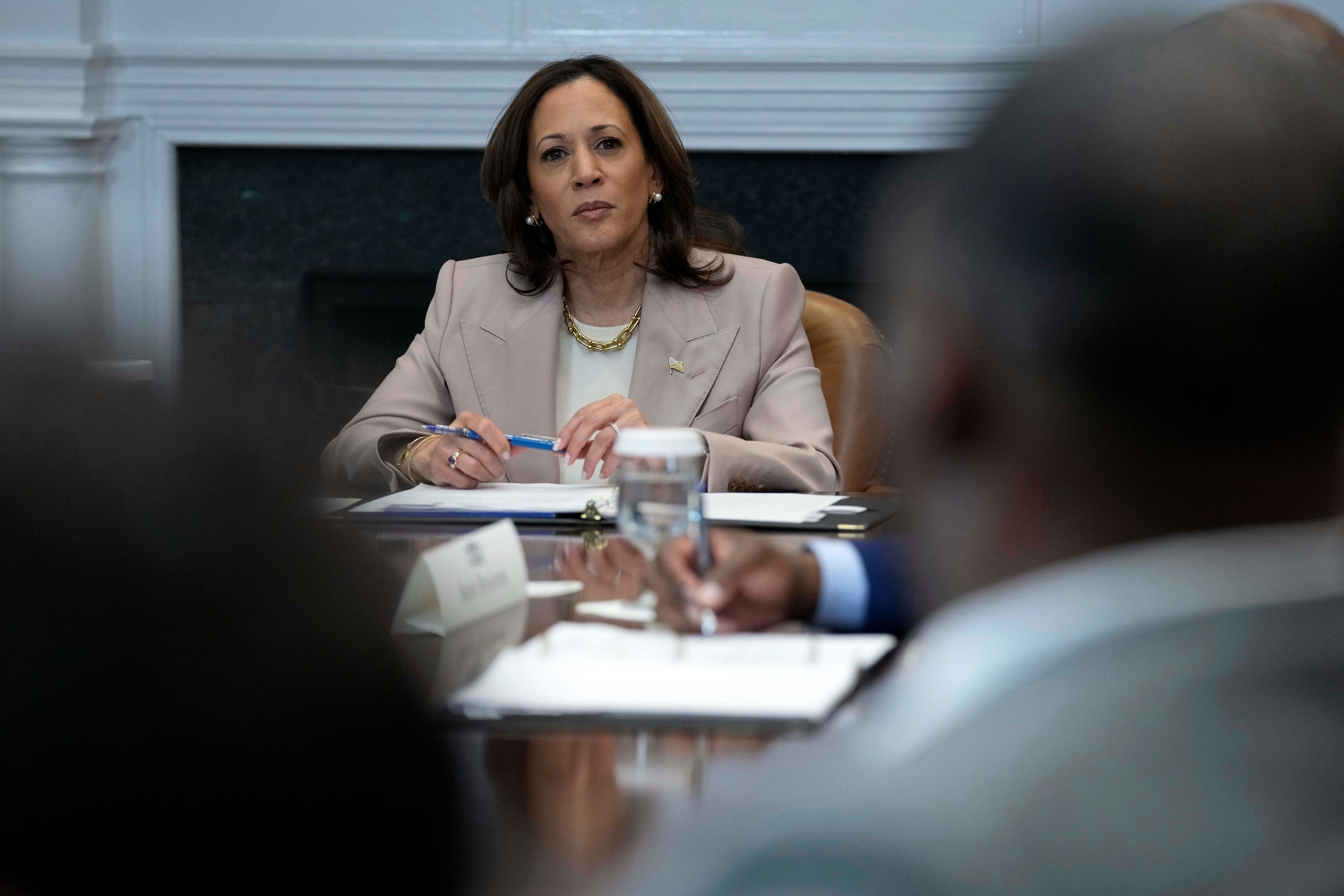 Vice President Kamala Harris listens during a discussion in the Roosevelt Room of the White House
