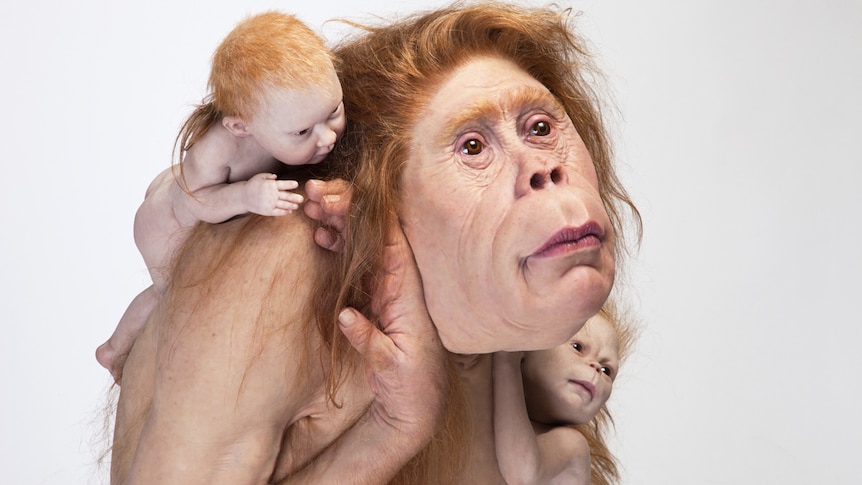 Detail of sculpture showing naked orangutan-human hybrid mother with two babies clinging to her shoulders.