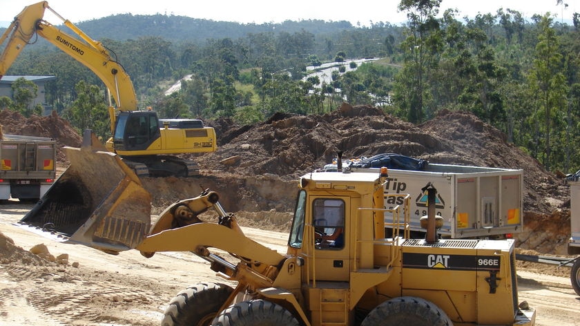 Construction machines and trucks at the site of stage one of Springfield Health City