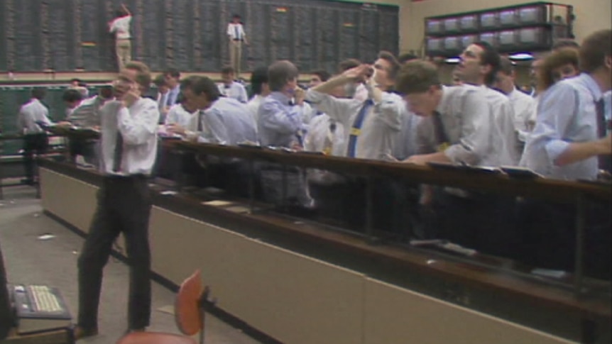 Traders shout orders on the floor of the stock exchange on October 20, 1987