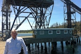 Wotif founder Graeme Wood stands at the Triabunna woodchip mill on Tasmania's east coast.