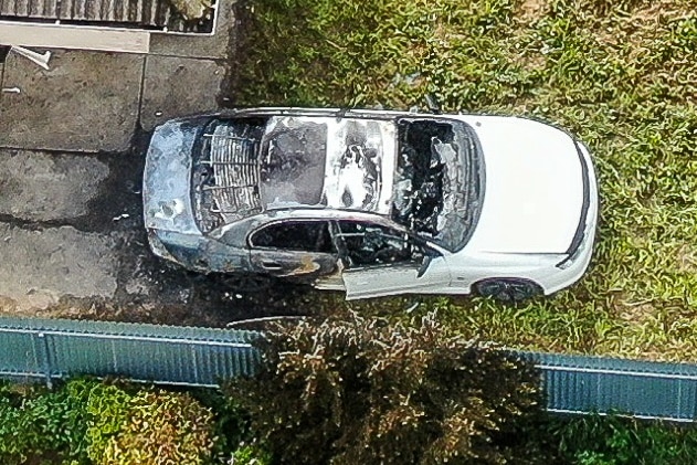 An overhead shot of a scorched wreck of a car in Mount Gambier.