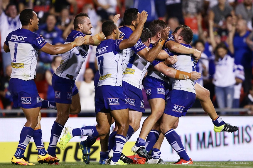 Bulldogs team-mates mob Kerrod Holland after winning conversion