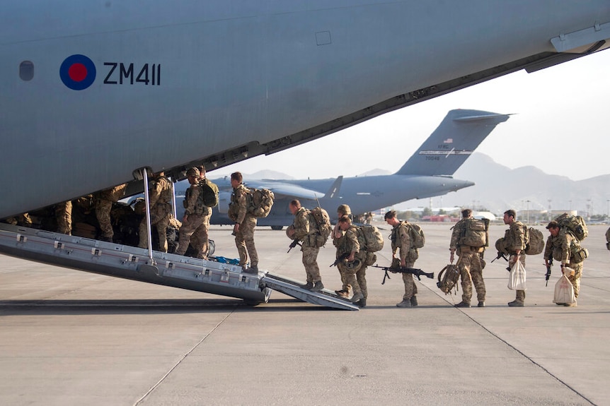 UK military personnel onboard a A400M aircraft departing Kabul, Afghanistan,