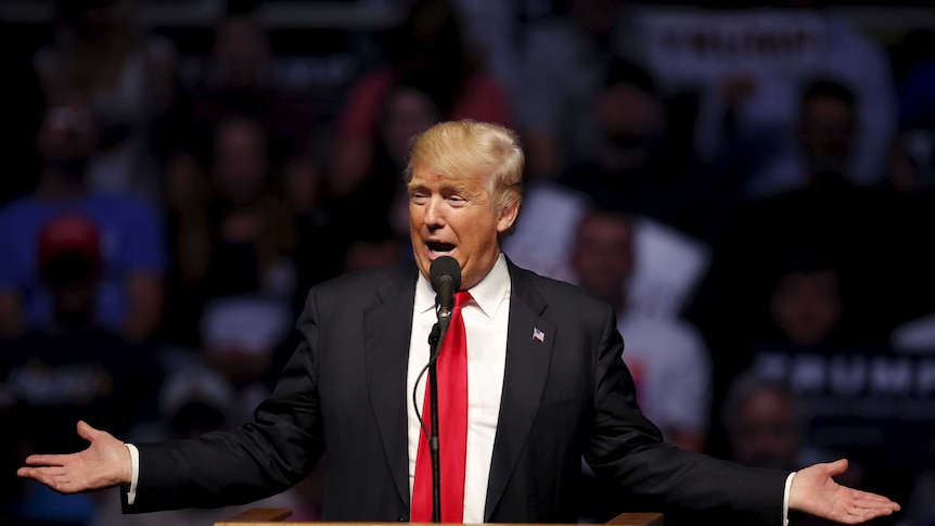 Donald Trump speaks at a lectern during a campaign event.