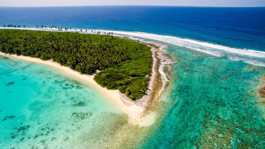 A small island as part of the Cocos Islands as seen from the air.