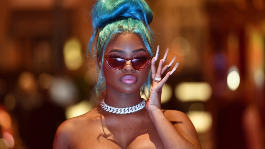 JT of City Girls with cool sunglasses