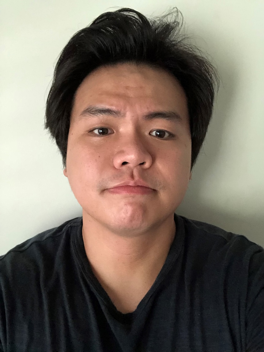 an asian man's profile shot