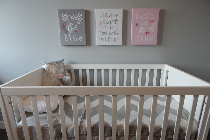 Empty cot in a baby's room.