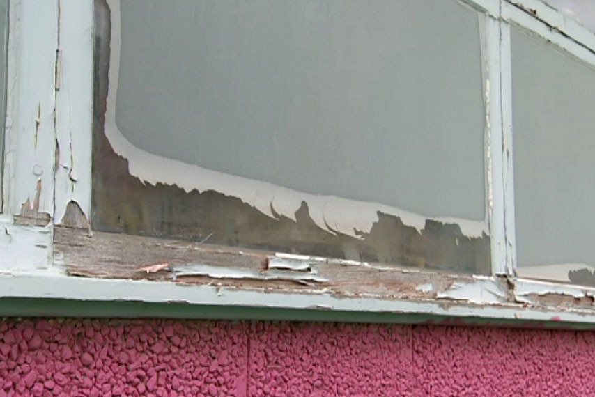 Peeling paint on a window at Dinjerra Primary School at Braybrook, in Melbourne's west.