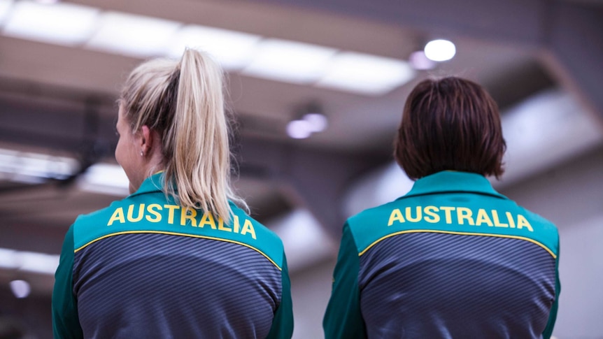 Diamonds players and coaches watch a game at the AIS in Canberra.