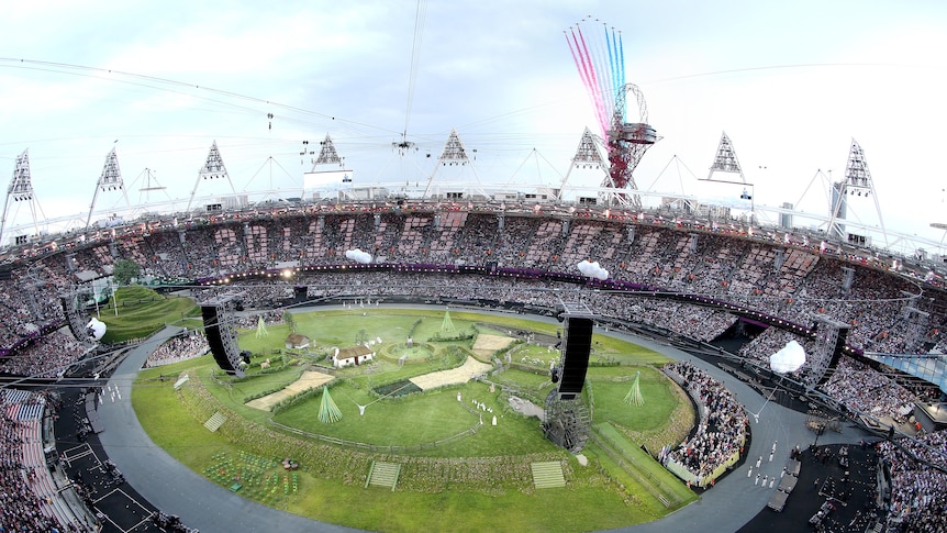 The Red Arrows perform a flyover prior to the Opening Ceremony of the London 2012 Olympic Games.