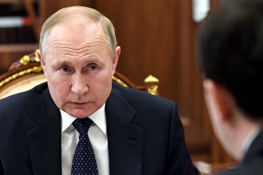 Vladimir Putin looks worried during a meeting in the Kremlin