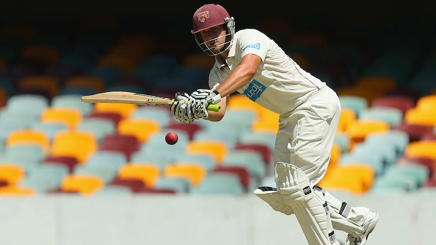 Queensland's Joe Burns bats on day one of the Shield game against Victoria at the Gabba.