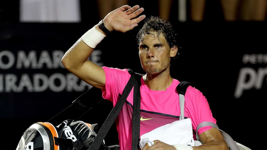 Spain's Rafael Nadal leaves the court after losing to Italy's Fabio Fognini at the Rio Open.