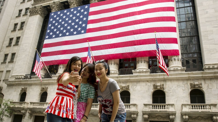 Chinese tourists in New York City wall street