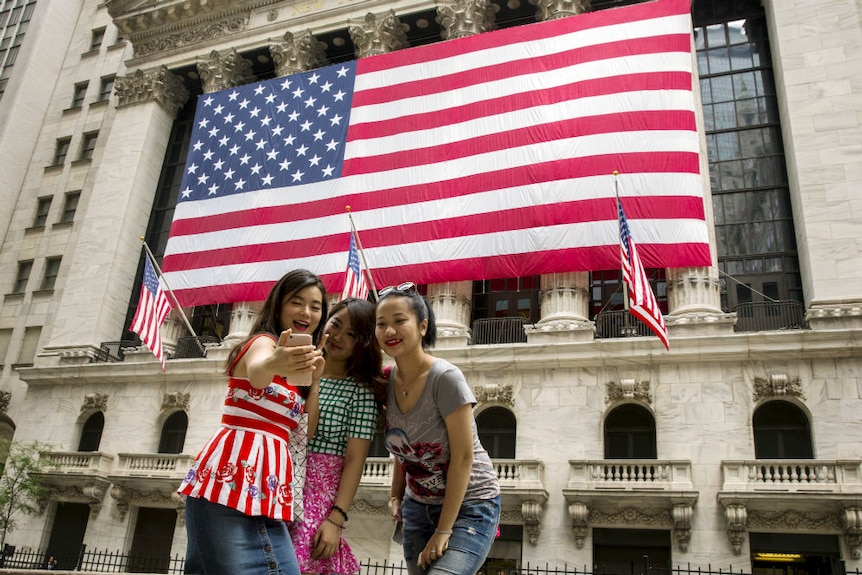 Chinese tourists in New York City wall street