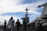Combat crews on the flight deck of the USS John C Stennis