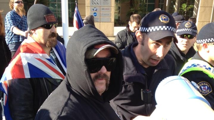 Tasmania Police with anti-Islam protesters in Hobart.