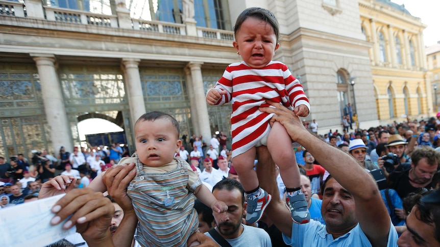 Asylum seekers outside Keleti train station