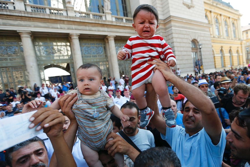 Asylum seekers outside Keleti train station