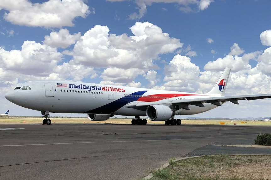 Malaysia Airlines plane on the tarmac.